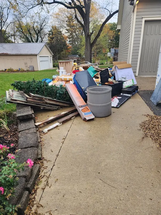 Dumpster being loaded with debris for 30 Yard Dumpster Rental in Fernandina Beach